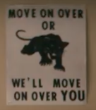 Black Panther poster on Mother's Milk's wall